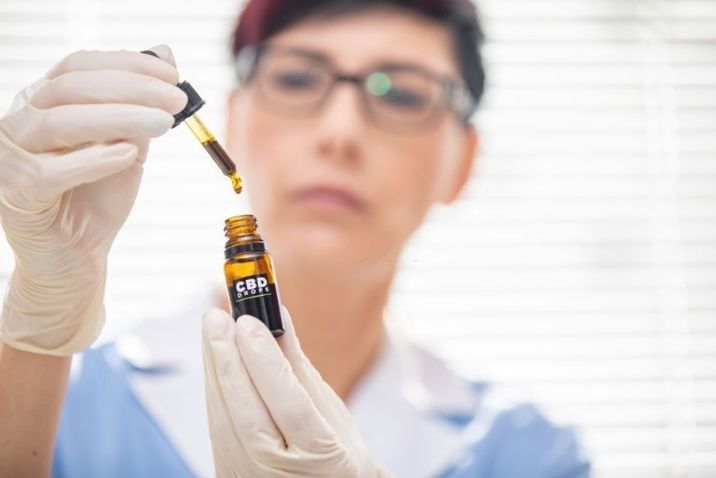 researcher checking the quality of cbd