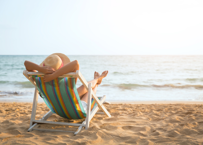 woman relaxing in the beach to manage mood swings