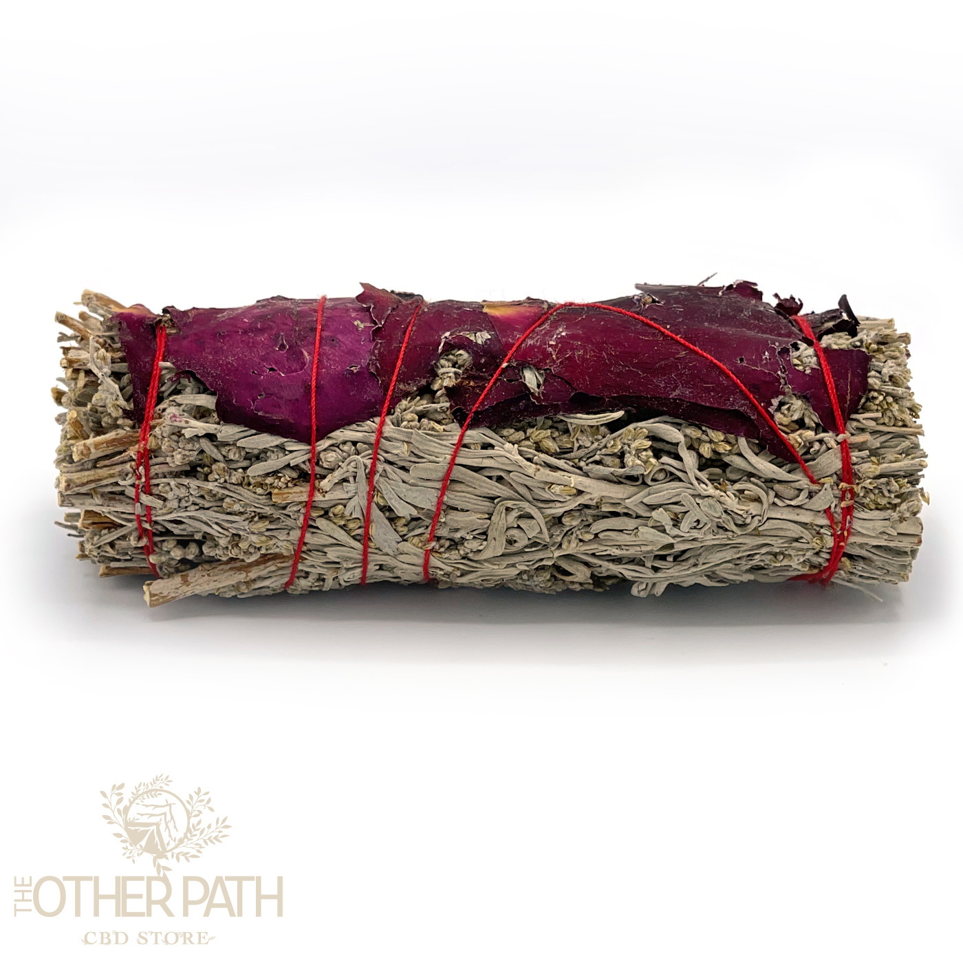 White sage smudge stick wrapped with red rose petals and tied with red string, used for cleansing and energy purification rituals