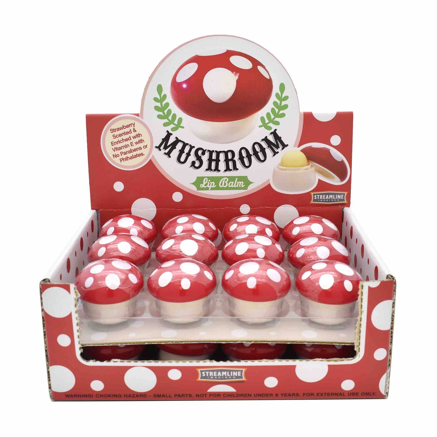 Display box containing multiple mushroom-shaped lip balm containers with red caps and white spots, labeled as strawberry scented and enriched with Vitamin E