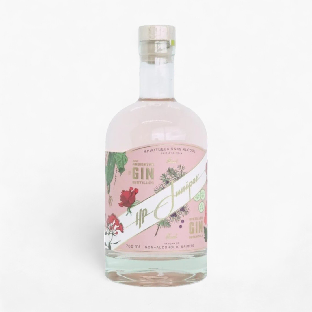 Clear glass bottle with a pink floral label reading 'HP Juniper' non-alcoholic gin, set against a white background.
