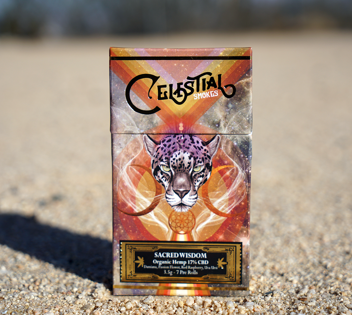 Celestial Smokes Sacred Wisdom pack featuring a vibrant cosmic design with a jaguar illustration, labeled as organic hemp pre-rolls with 17% CBD and blended botanicals